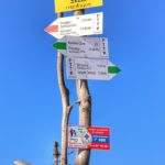 Żółta tabliczka z napisem Malinowska Skała - 1152 m n.p.m.